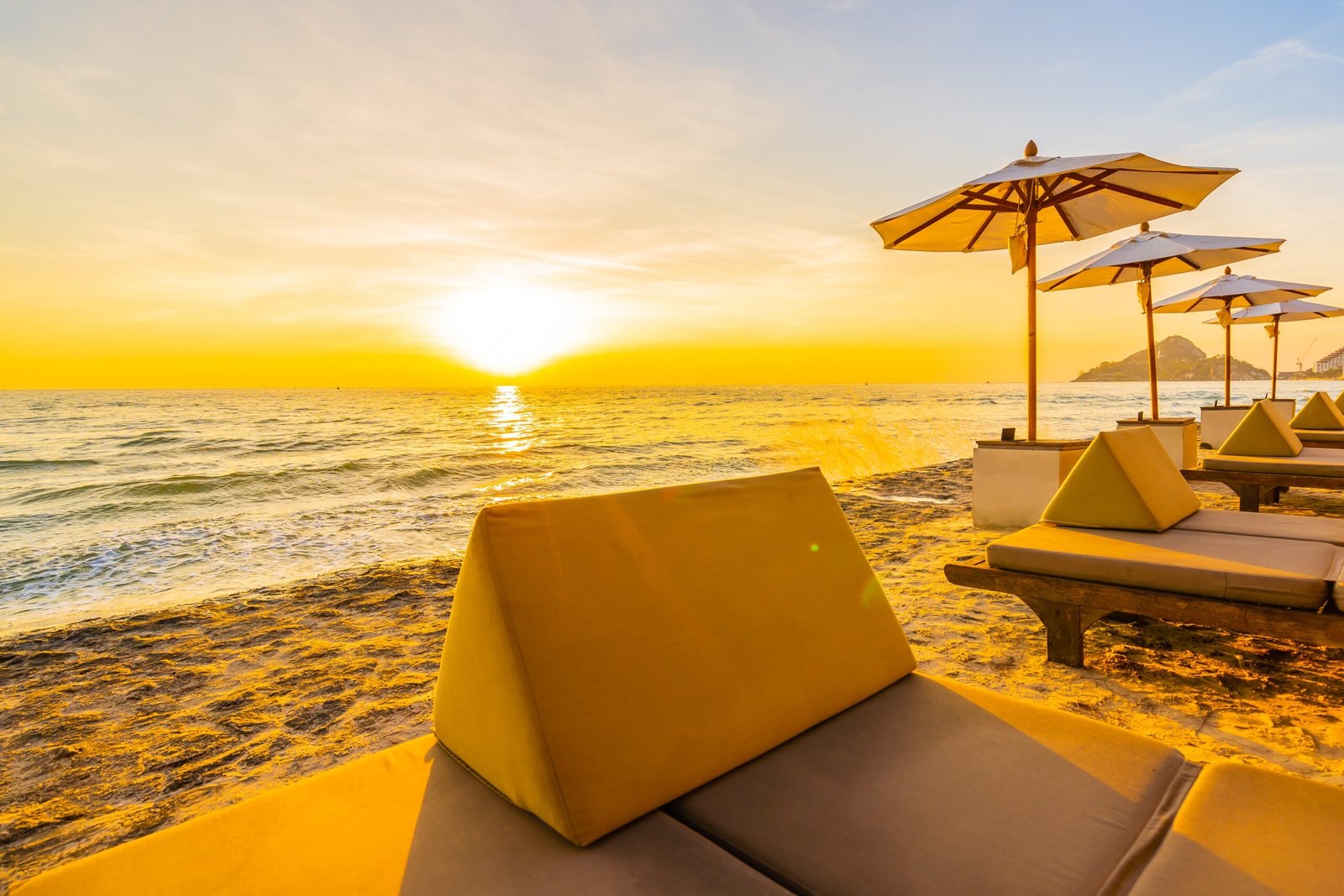 About Us Umbrella Chair With Pillow Around Beautiful Landscape Beach Sea Scaled
